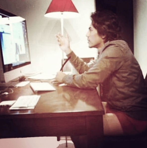 John Kim at his computer, talking to a client on screen